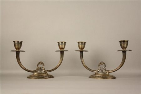 Coppia di candelabri in argento, gr. 600 ca. Marcati 800 - 29PD. Inizi XX...