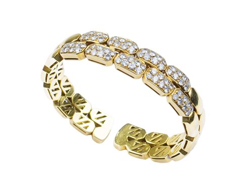 BRACCIALE A MANETTA IN ORO GIALLO 18KT con diamanti taglio brillante per ct...