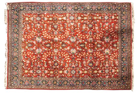 TAPPETO VERAMIN Persia, XX Sec. con decorazione floreale a tutto campo su...