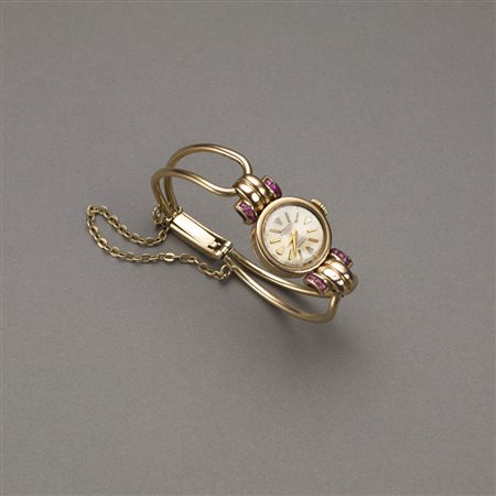 Orologio anni 1930/40 ca. da donna in oro rosso e rubini carrè con catenella...