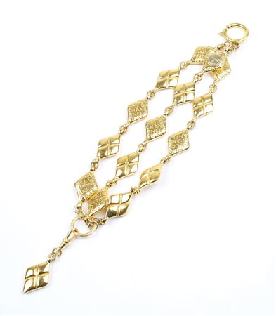 CHANEL, BRACCIALE BIJOU VINTAGE firmato, 1980 in metallo dorato A BIJOU...