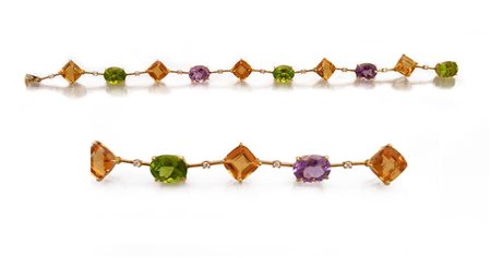 ORECCHINI BRACCIALE. In oro giallo 18 kt con quarzi e peridoti taglio ovale e...