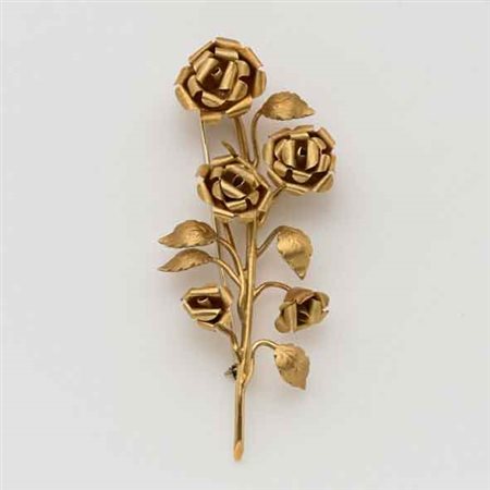 Spilla in oro giallo a guisa di gambo fiorito, g.16,40 Gold brooch