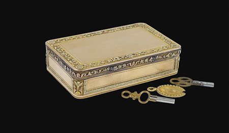 Scatola musicale in oro Ginevra, 1820 circa dim. 2,5x8,3 cm. due melodie con...