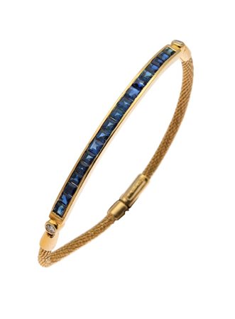 BRACCIALE Peso gr 13,6 in oro giallo con al centro segmento rigido con...