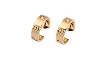 CARTIER Peso gr 9,6 Coppia di orecchini in oro giallo, firmati "Cartier", con...