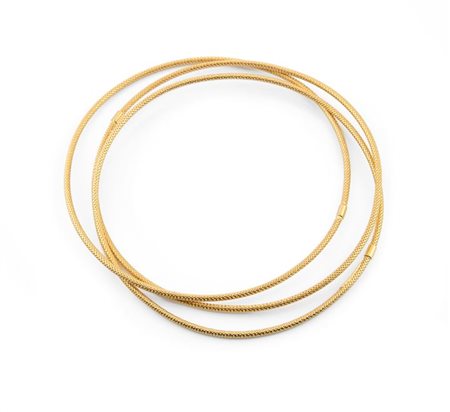 BRACCIALE Peso gr 9,2 in oro giallo composto da tre fili rigidi lavorati a...